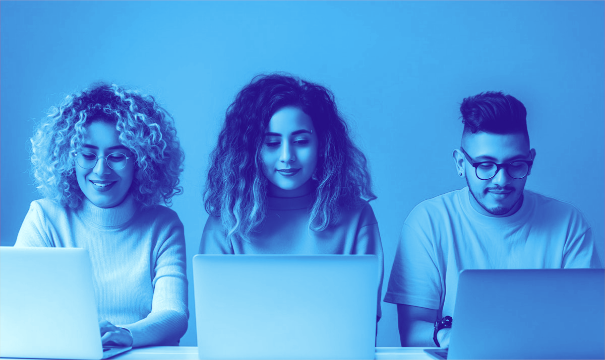Three Adults Working on Laptops